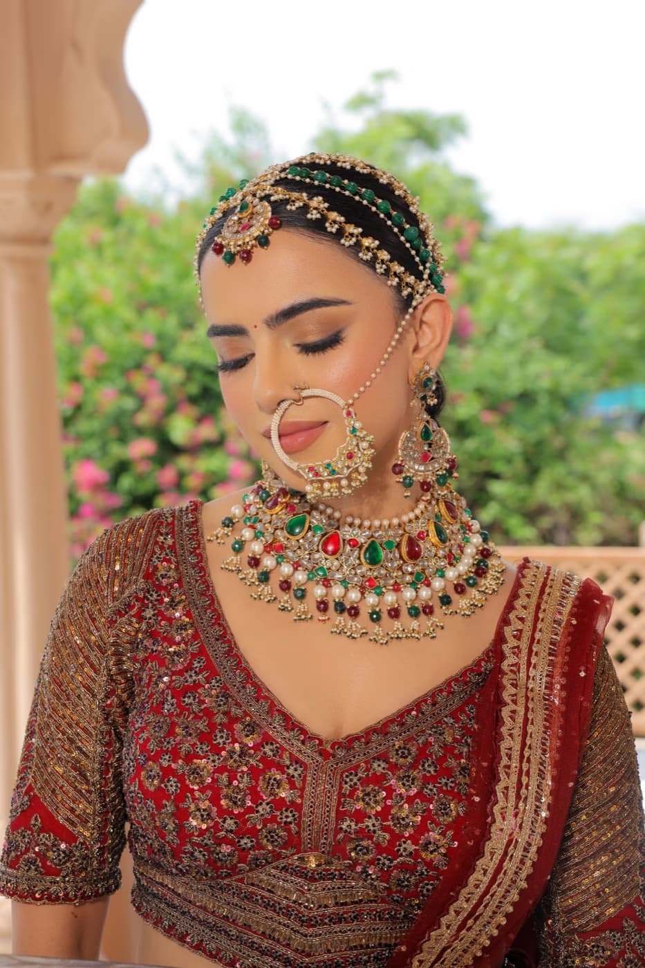 Indian bridal makeup by Elani Artistry, richly pigmented eyes, flawless base and traditional adornments
