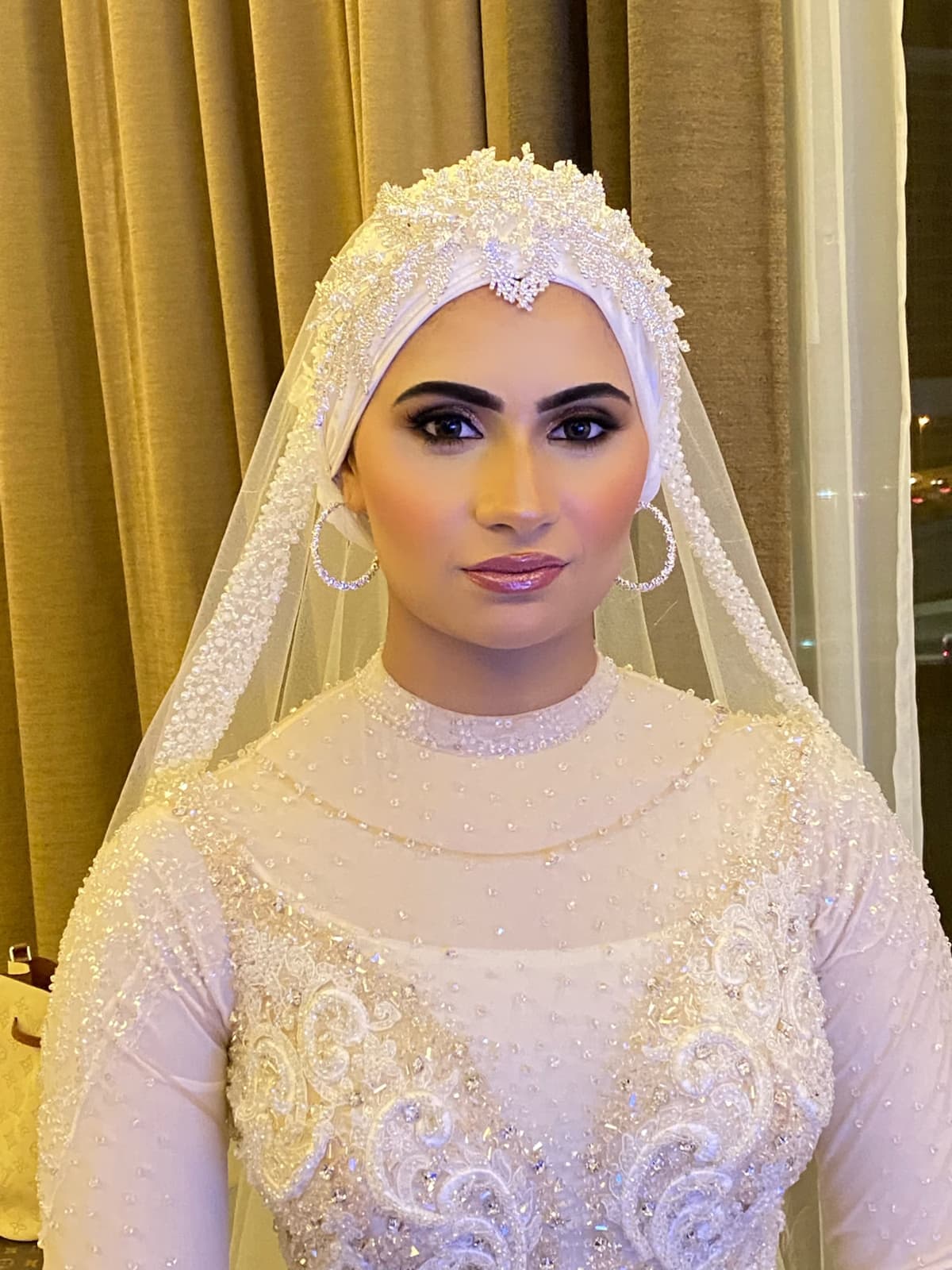 Egyptian bride in Sharjah with classic Arabic bridal makeup, luminous base defined elongated eyes and timeless elegant finish by Elani Artistry
